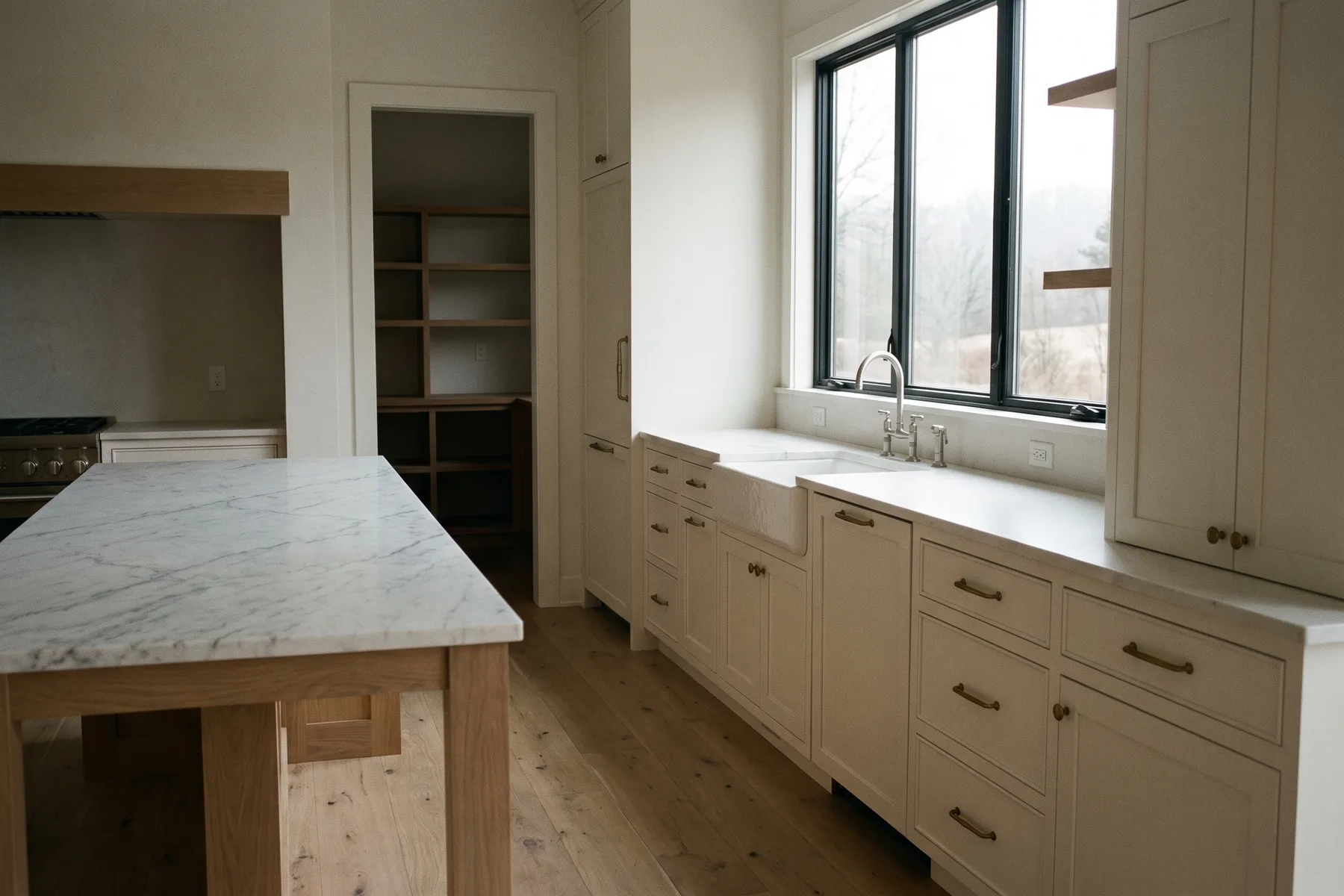 Rendering — The Heron kitchen with its working island and walk-in pantry.