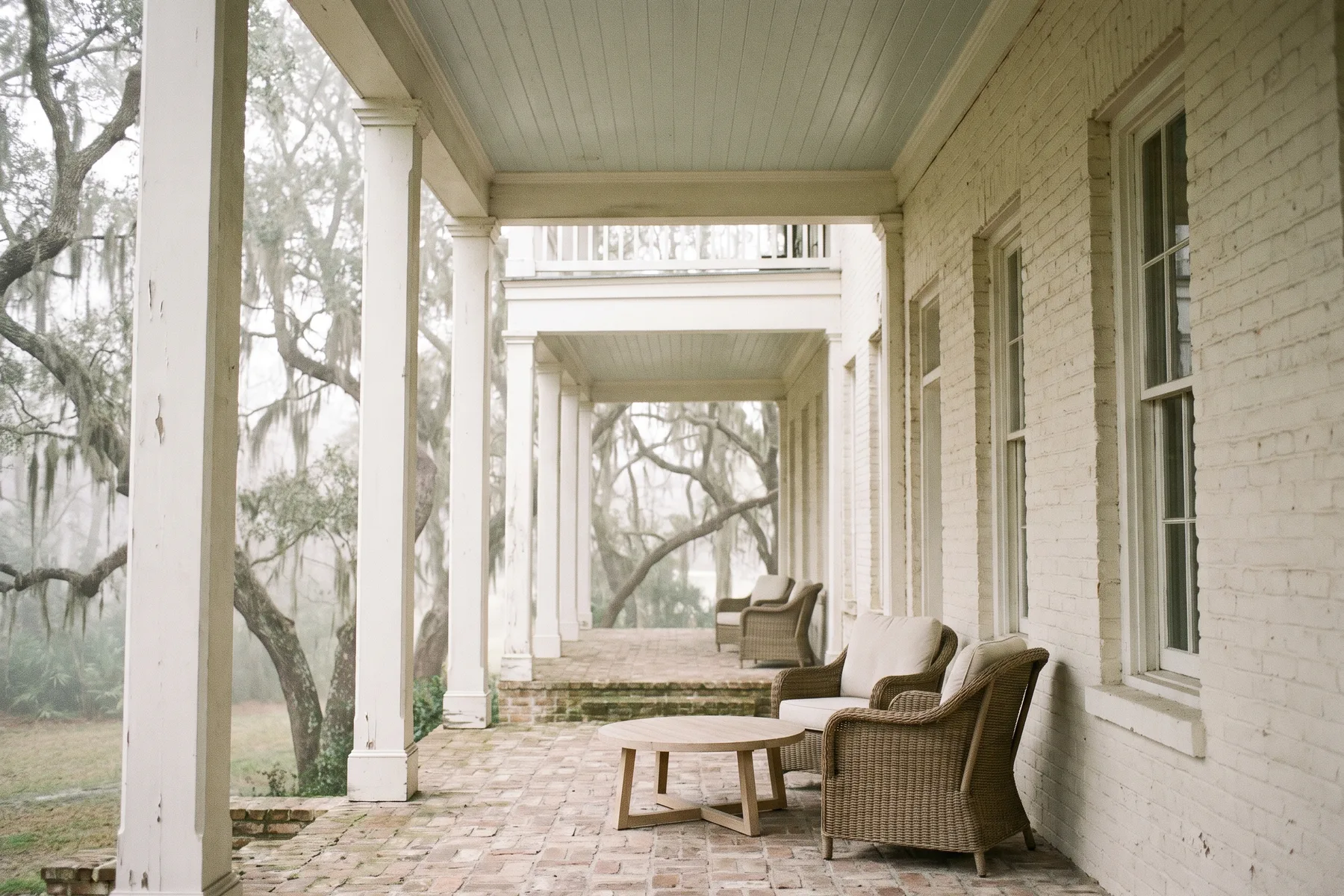 Rendering — The Heron two-story covered porch seen along its length.
